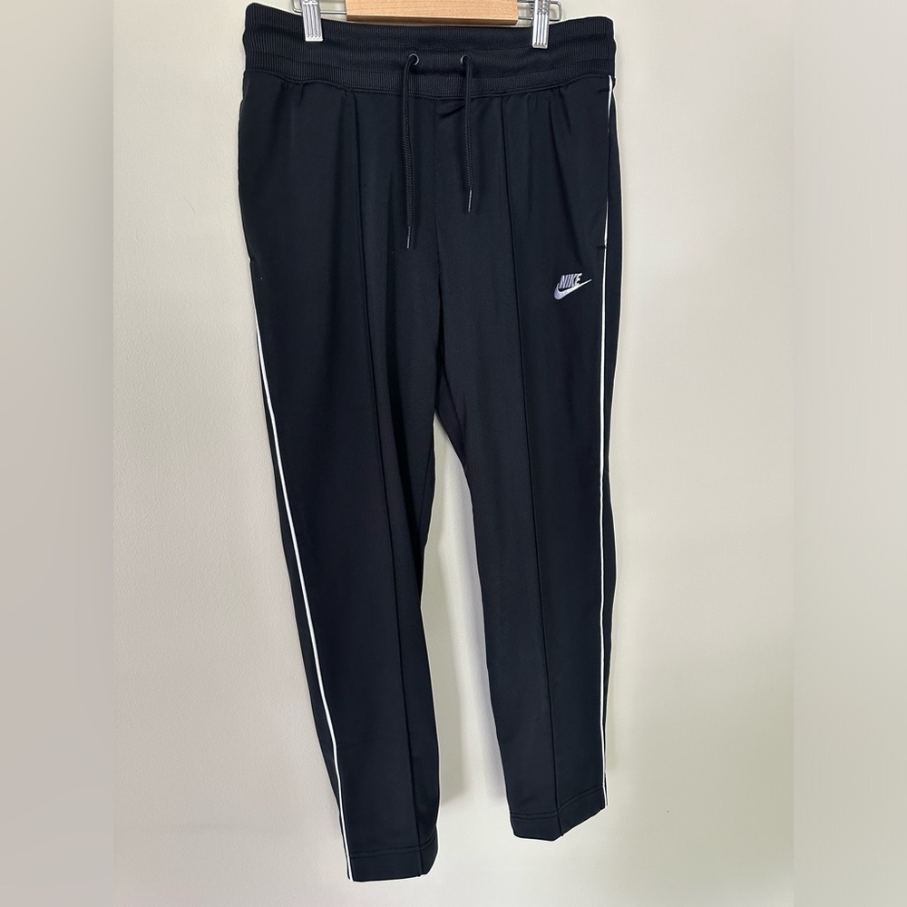 NWOT. Nike women’s track pants.